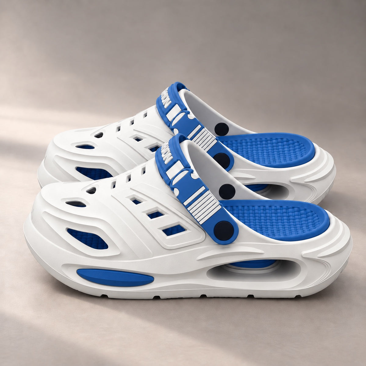 The Recovery Clog in white with blue details, side view
