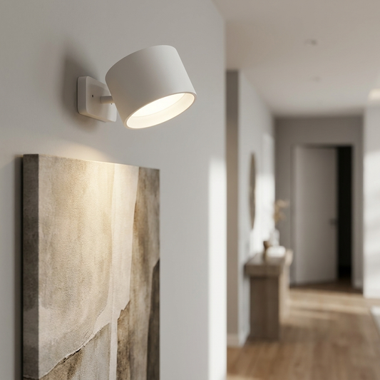Rechargeable wall light illuminating art in modern hallway