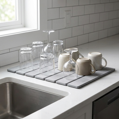 Diatomite stone dish mat drying glasses in kitchen