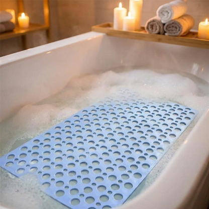 Non slip bath mat placed inside a spa-like filled bathtub