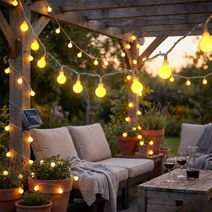 Solar fairy lights on backyard patio at dusk