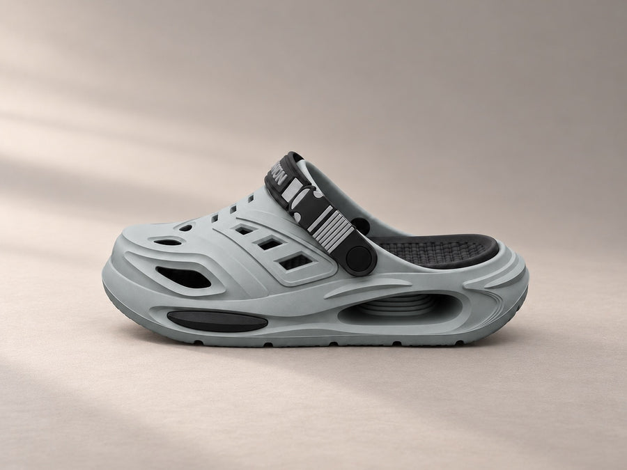 A grey Recovery Clog seen from the side